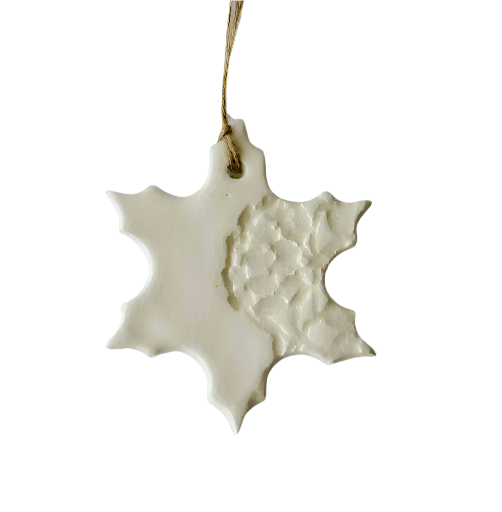 White Handmade Snowflake Ceramic Ornament with decorative imprint hanging