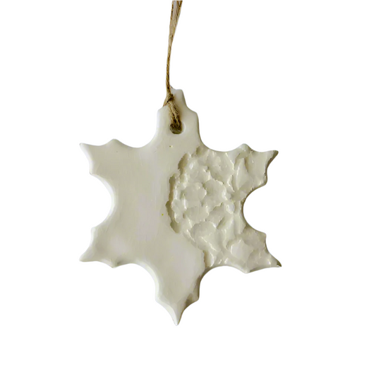 White Handmade Snowflake Ceramic Ornament with decorative imprint hanging