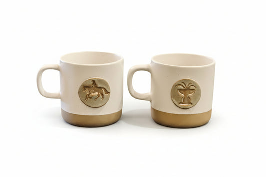 The Rooted Plow is proud to partner with an Alabama USA-based small batch pottery business that employs women who have escaped homelessness, sex-trafficking and domestic abuse. These hand-made 10 ounce mugs boast medallions that reflect our iconic Horse & Rider and Ridgefield Cass Gilbert Fountain designs