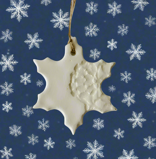 White Handmade Snowflake Ceramic Ornament with decorative imprint hanging